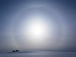 Sun halo appears on a hill